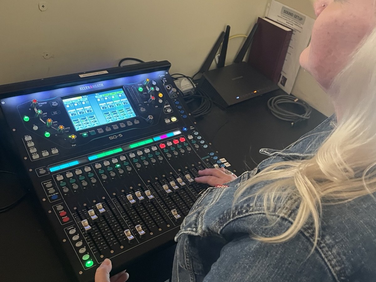 Nunn Services team member operating a digital console