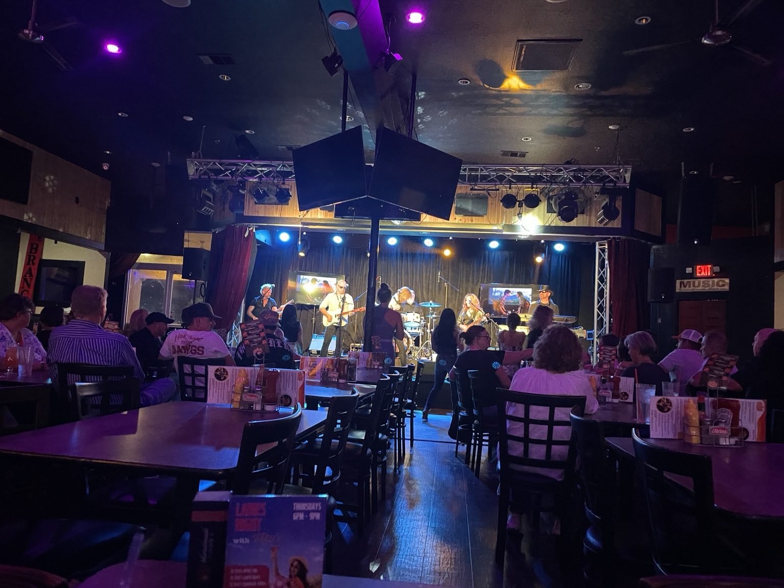 Live music venue with audience and stage lighting